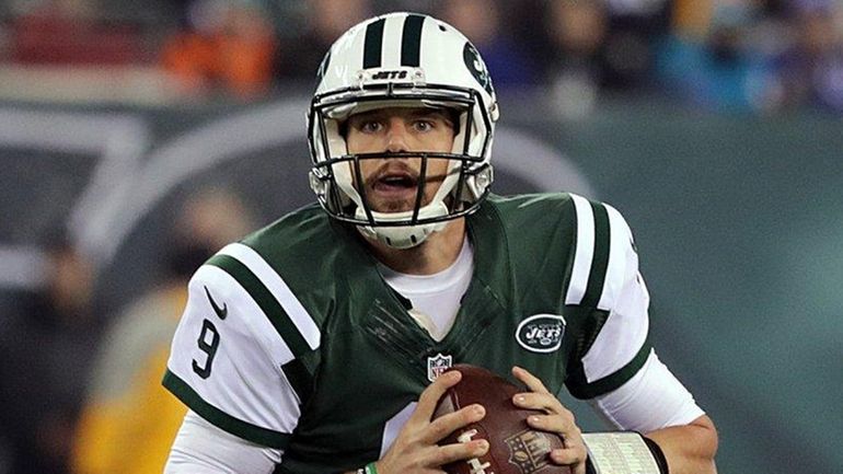 New York Jets quarterback Bryce Petty (9) rolls left looking...