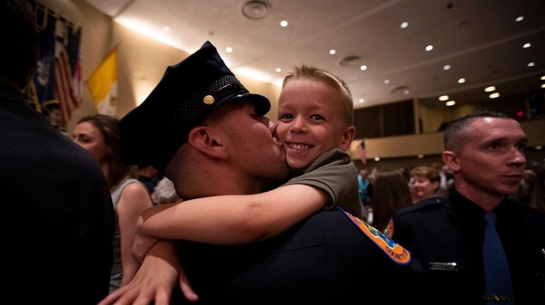 Marc Cira shares a moment with family at Chaminade High...