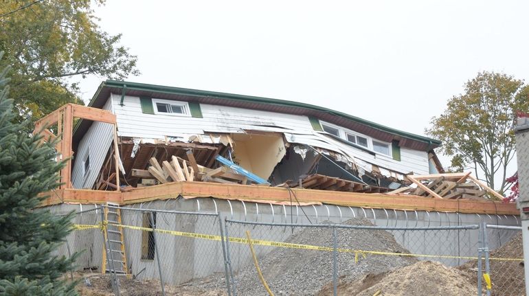 The collapsed house on Coppertree Lane in Babylon on Friday...