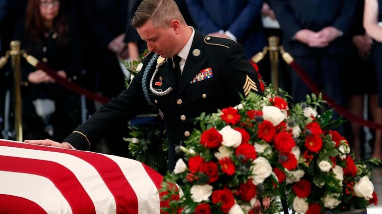 Jimmy McCain, son of Sen. John McCain, R-Ariz., pauses at...