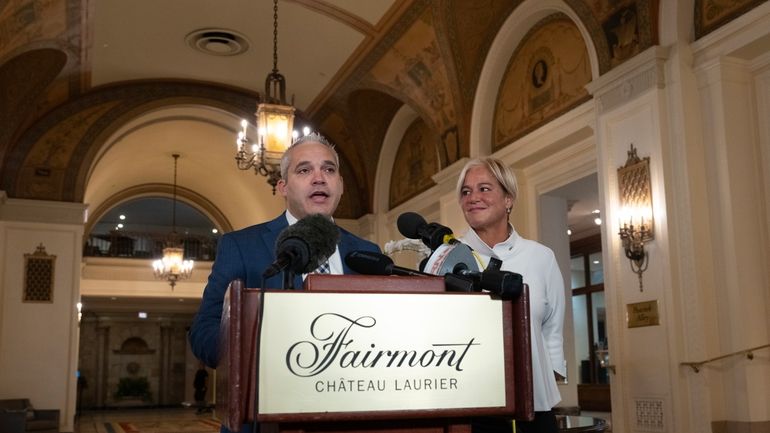 Fairmont Chateau Laurier General Manager Genevieve Dumas looks on as...