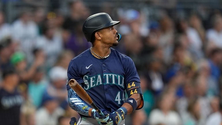 Seattle Mariners' Julio Rodriguez watches his home run during the...