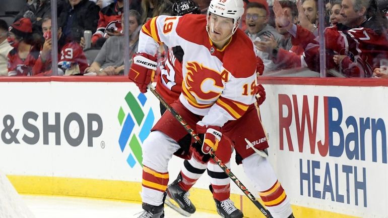 FILE - Calgary Flames left wing Matthew Tkachuk (19) looks...