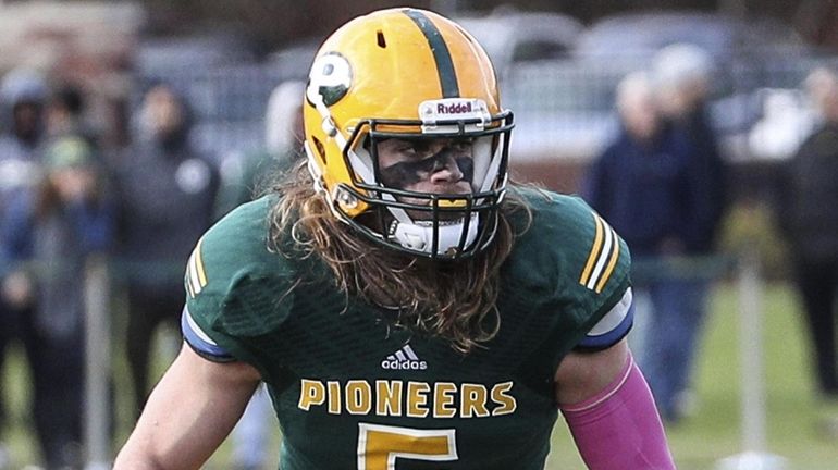 Jake Carlock of LIU Post waits for the snap at...