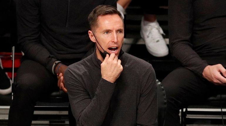 Head coach Steve Nash of the Nets looks on in...