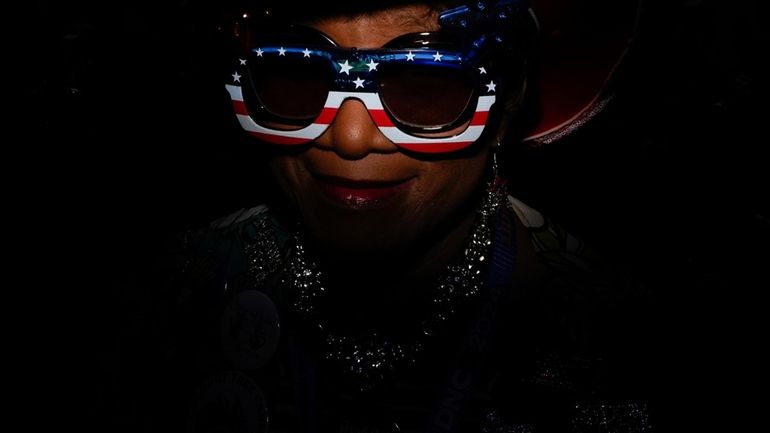 North Carolina delegate Gloria Goodwin wears sunglasses during the Democratic...