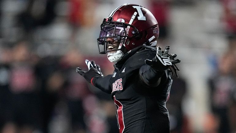 Indiana defensive back Noah Pierre gestures after Akron place-kicker Dante...