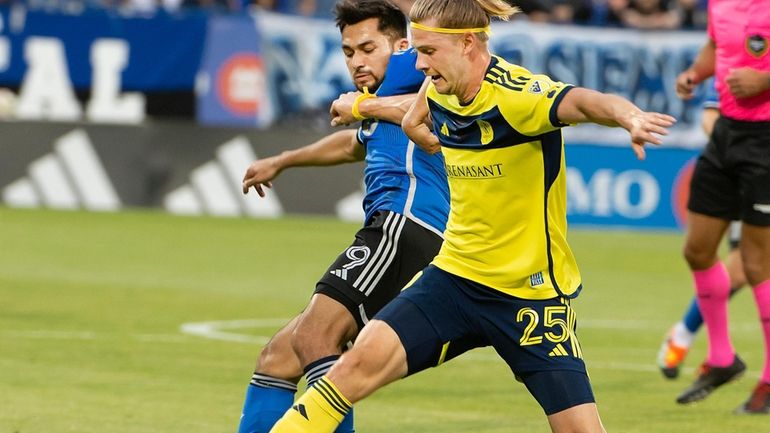 CF Montreal's Mathieu Choiniere, left, and Nashville SC's Walker Zimmerman...