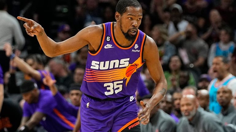 Phoenix Suns forward Kevin Durant (35) motions after making a...
