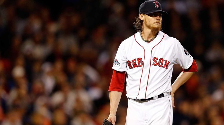 Clay Buchholz of the Boston Red Sox looks on against...