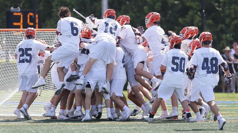 Virginia celebrates their overtime win in an NCAA men's lacrosse quarterfinal...