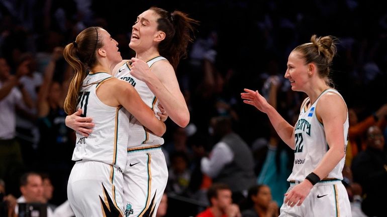 From left, Liberty guard Sabrina Ionescu, forward Breanna Stewart and...