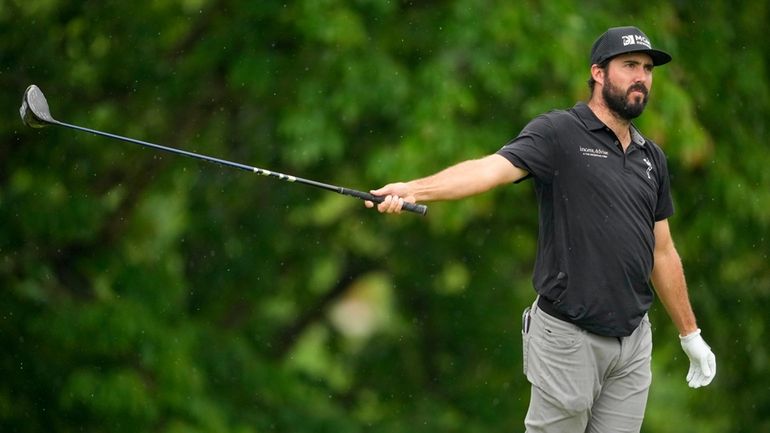 Mark Hubbard watches his tee shot on the 18th hole...