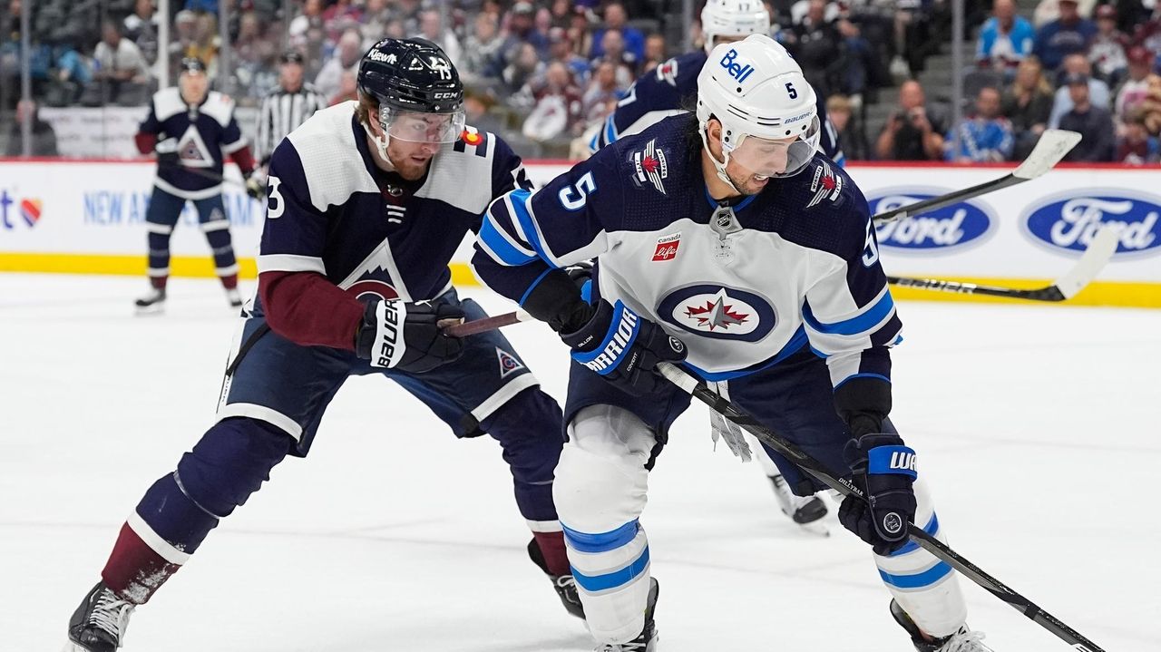 Jets' Brenden Dillon day-to-day after receiving stitches on hand for ...