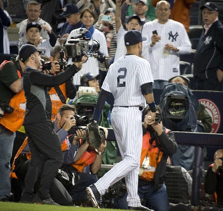 Derek Jeter and the entire New York Yankees team tip their hats to the fans  after the game against the Baltimore Orioles in the final game ever at  Yankee Stadium in New