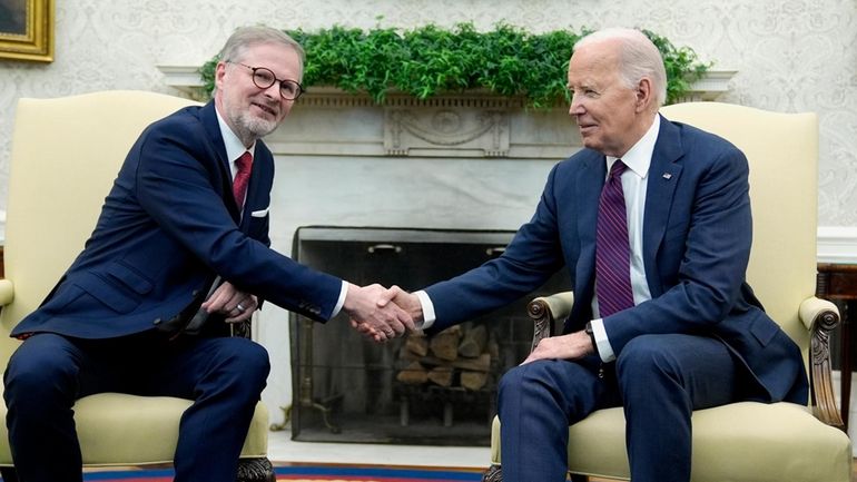 President Joe Biden, right, and Prime Minister Petr Fiala of...