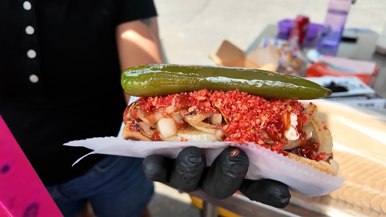 Bacon-wrapped with spicy Cheetos on top: Trying a Mexican hot dog