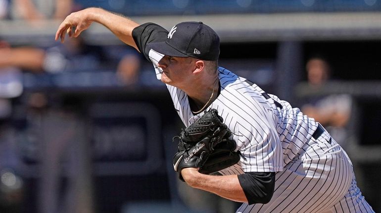 Yankees pitcher Clarke Schmidt throws during the first inning of...