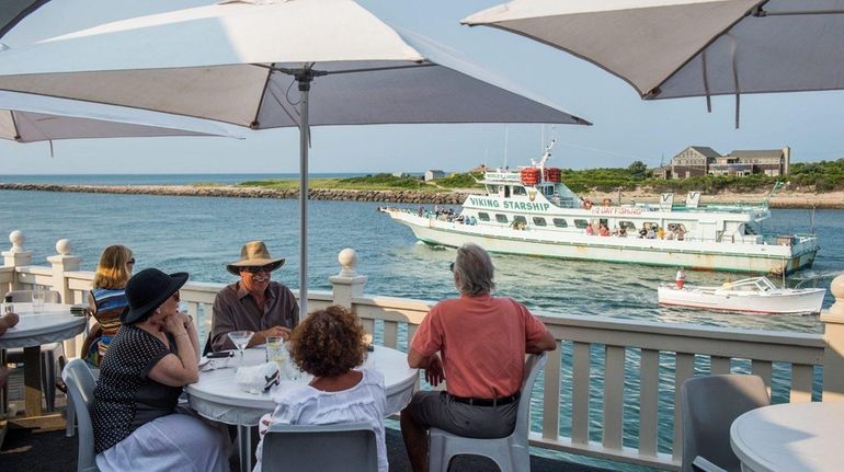 Diners overlook Montauk Inlet at Gosman's Dock in Montauk.