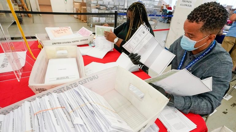 New York City Board of Election staff members count absentee...