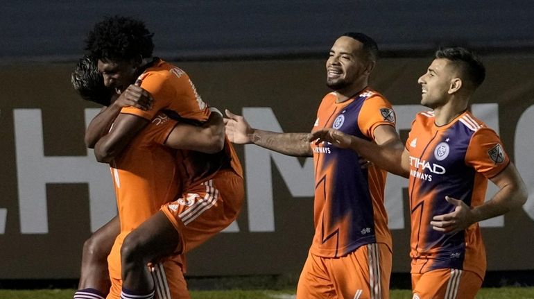 Talles Magno of New York City FC, top, celebrate with...