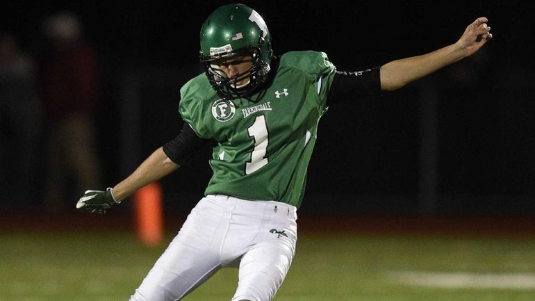 Farmingdale's Zach Kolodny kicks off against MacArthur in a Nassau...