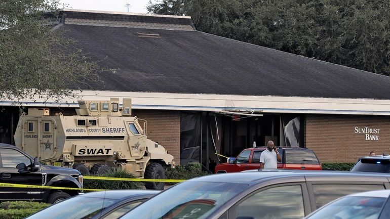 A Highlands County Sheriff's SWAT vehicle is stationed out in...