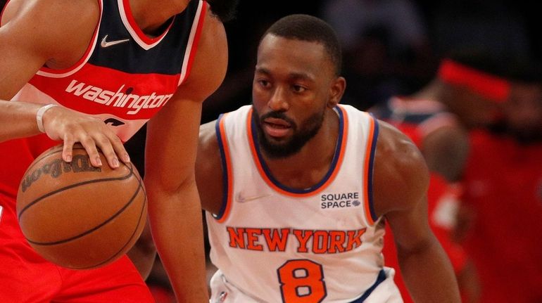 Kemba Walker #8 of the New York Knicks defends at...