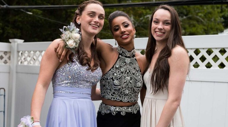 Lauren 'Boogie' Brozoski, center, with her basketball teammates Erin Storck,...