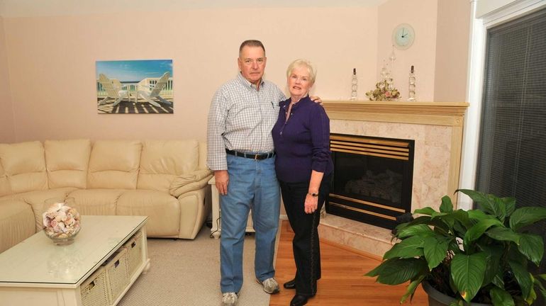 Mary Ellen and Eric Brengartner, pictured in their family room,...