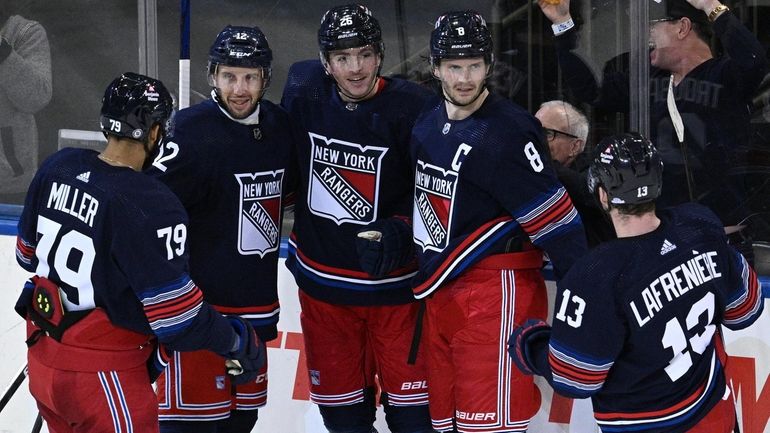 Rangers players celebrate a goal by left wing Jimmy Vesey...