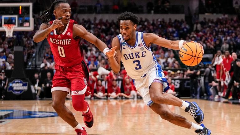 Duke's Jeremy Roach (3) drives against North Carolina State's DJ...