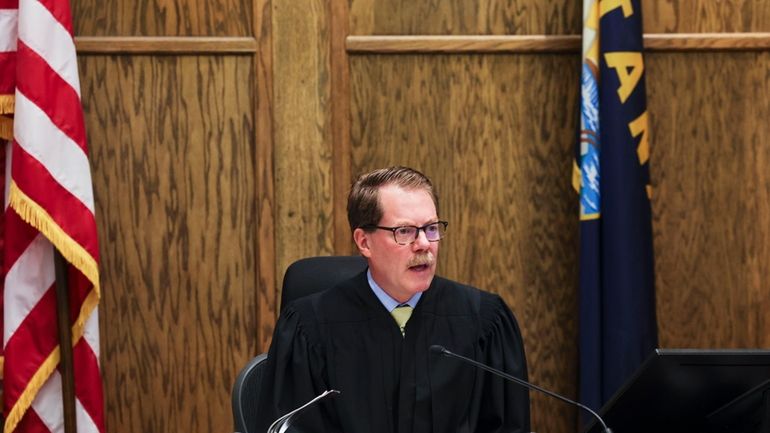 Lewis and Clark District Court Judge Mike Menehan speaks during...