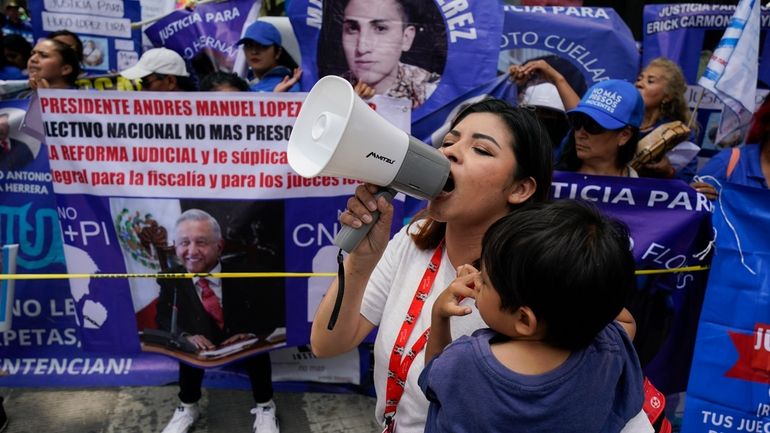 Relatives of prisoners rally in favor the government's proposed judicial...