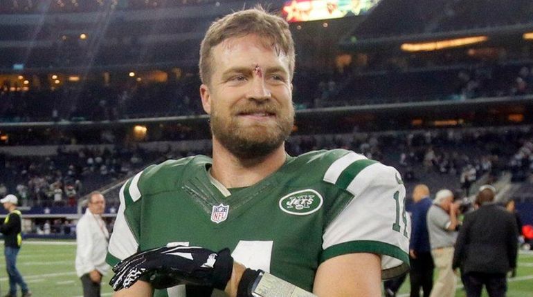 New York Jets quarterback Ryan Fitzpatrick (14) smiles as he...