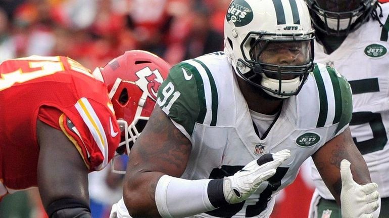 New York Jets defensive end Sheldon Richardson celebrates after sacking...