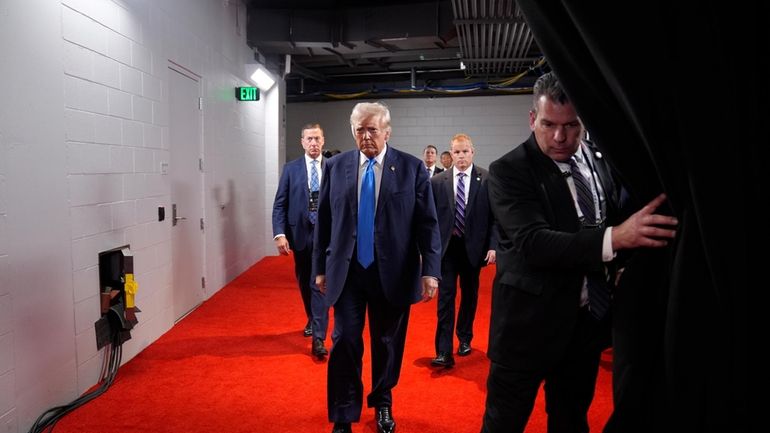 Republican presidential candidate former President Donald Trump arrives during the...