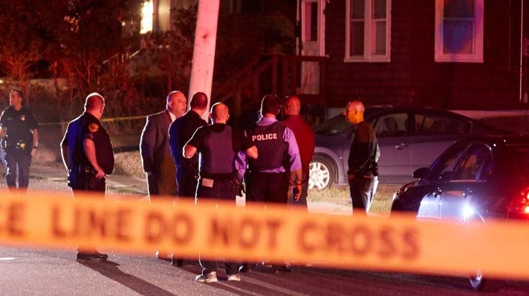 Suffolk County police officers and detectives at the corner of...