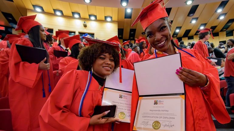 Keywanda Ashley, right, and Naomy Seiry Arzu Cruz show off...