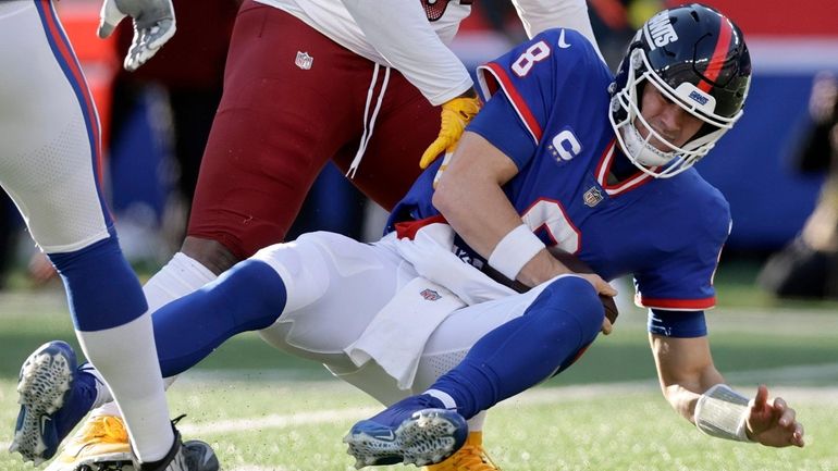 Daniel Jones of the Giants is sacked in the first half by...