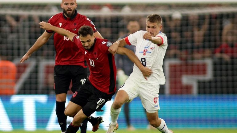 Czech Republic's Michal Sadilek, right, challenges for the ball with...