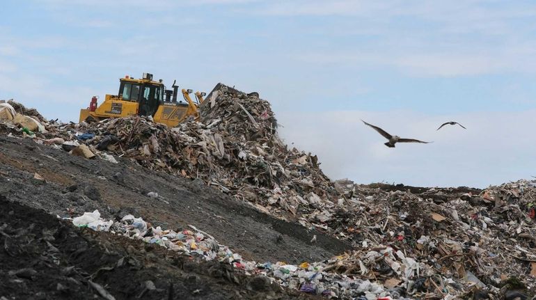 A plow is used to move waste at the Brookhaven...