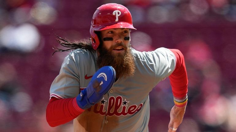 Philadelphia Phillies' Brandon Marsh runs from second to score on...