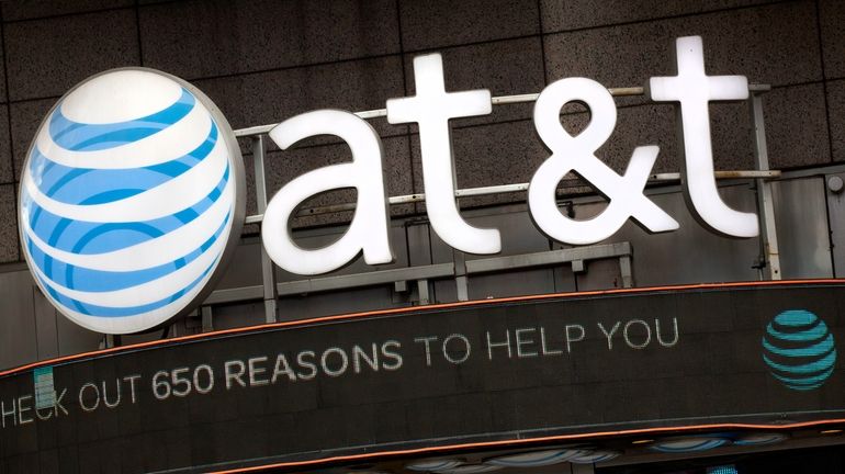 The AT&T logo is positioned above one of its retail...