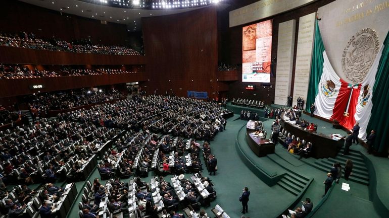 Legislators fill the lower house of Congress as the wait...