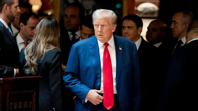 Former President Donald Trump arrives for a news conference at...