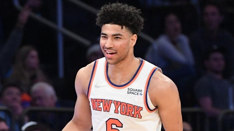 Knicks guard Quentin Grimes reacts after his three-point basket against...