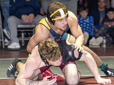 LI boys wrestlers honor iconic coach at 50th Sprig Gardner tournament