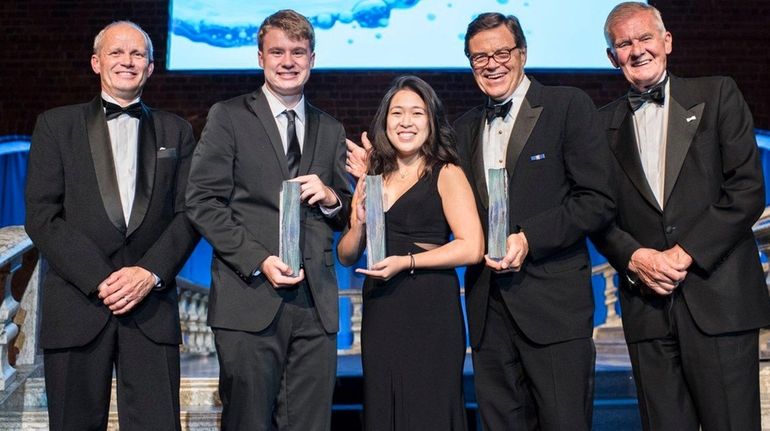 Ryan Thorpe, second from left, and Rachel Chang, center, were...