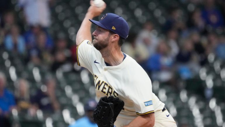 Milwaukee Brewers pitcher Colin Rea throws during the first inning...